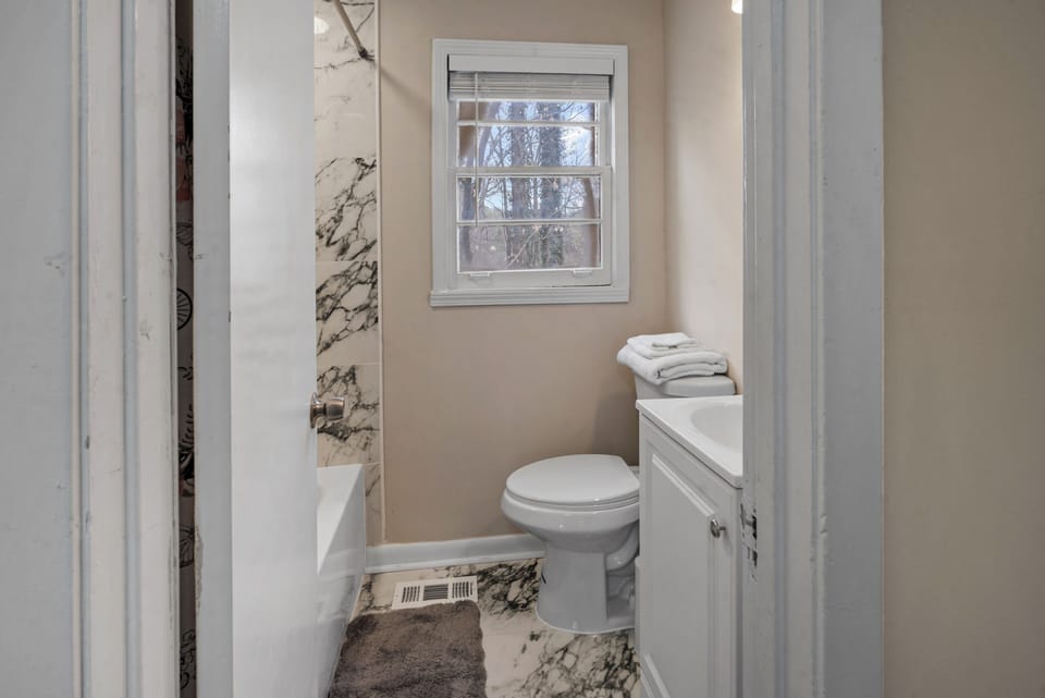 Well-appointed bathroom with fresh towels and modern touches.