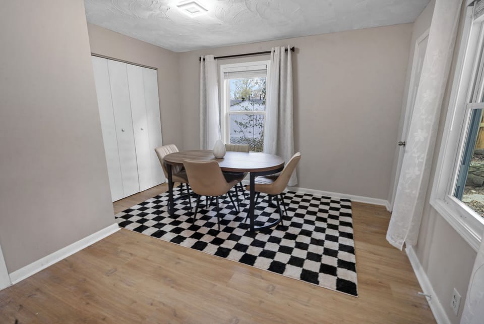 Charming dining space with stylish seating and natural light.
