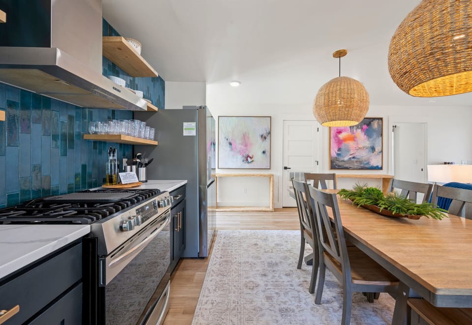 Sleek countertops and clean lines give the kitchen a polished, modern feel while still maintaining a warm and inviting atmosphere.