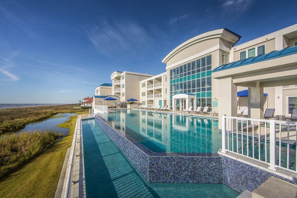 Unwind by the luxurious poolside, surrounded by lush greenery and modern architecture.