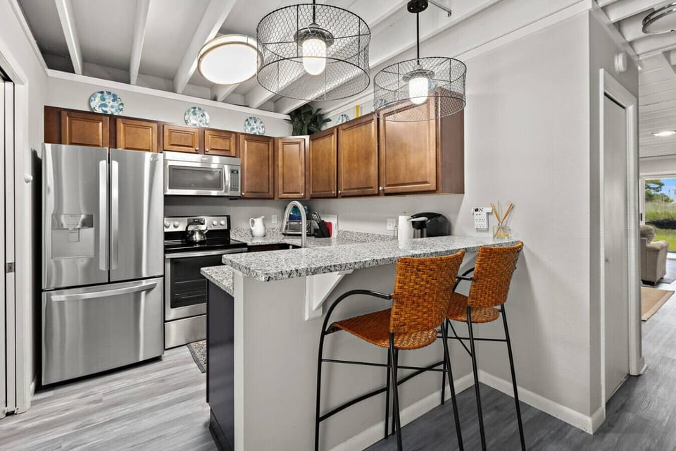 Fully equipped kitchen with modern appliances—perfect for cooking and entertaining