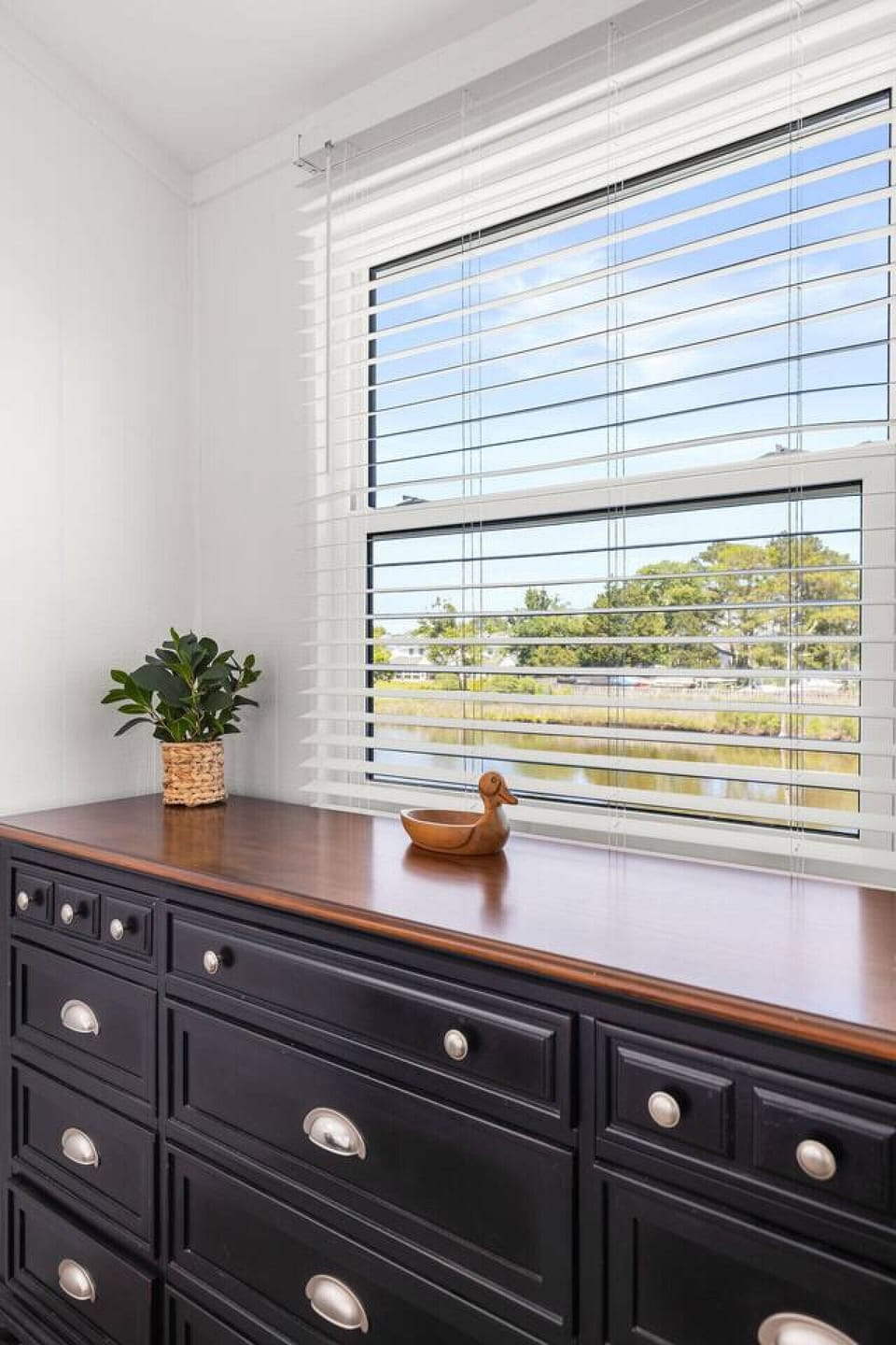 Spacious bedroom with a plush bed and calming atmosphere for a restful night’s sleep