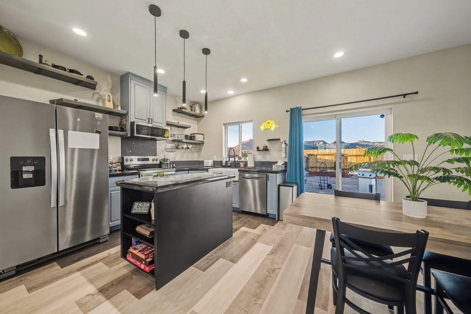 Fully stocked modern kitchen with stainless steel appliances—perfect for cooking after a day exploring