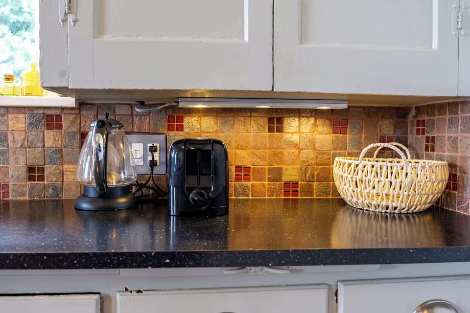 Toaster and instant hot water kettle for quick meals and tea.