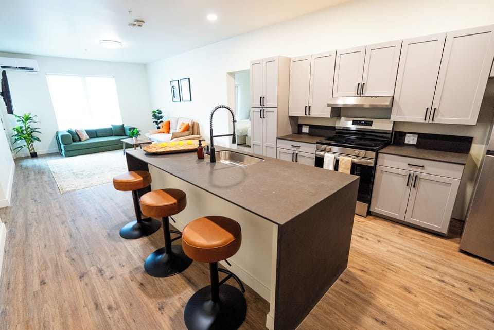 Deluxe Suite, 2 Bedrooms | Private kitchen | Full-size fridge, microwave, oven, stovetop