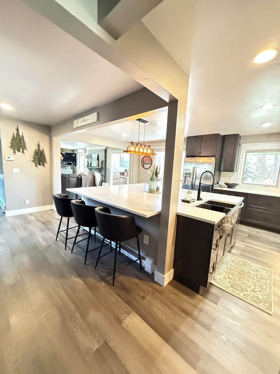 Luxury gourmet entertainer’s kitchen with oversized island, quartz countertops
