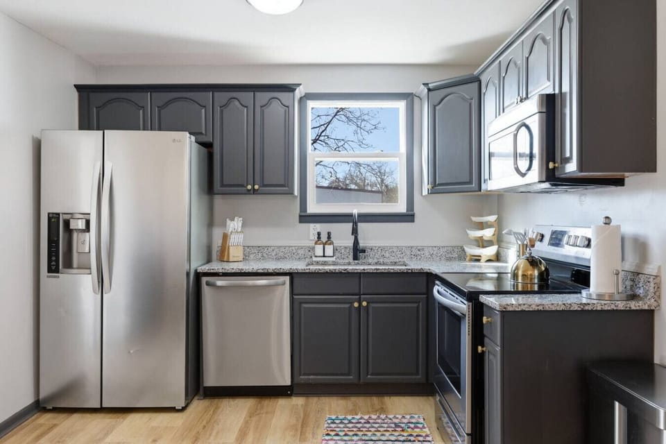 The kitchen is fully equipped with appliances and all the cooking essentials you may need. Enjoy meals at the dining table.