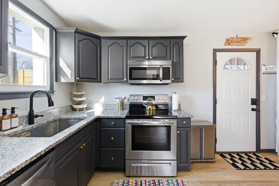 The kitchen is fully equipped with appliances and all the cooking essentials you may need. Enjoy meals at the dining table.