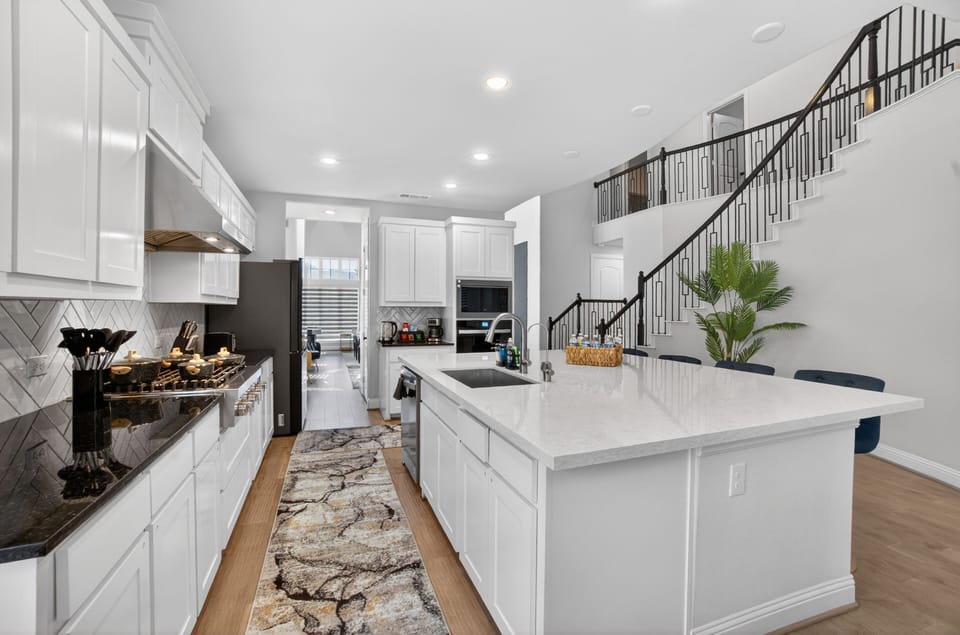 Bright and airy kitchen designed for cooking and cocktails.