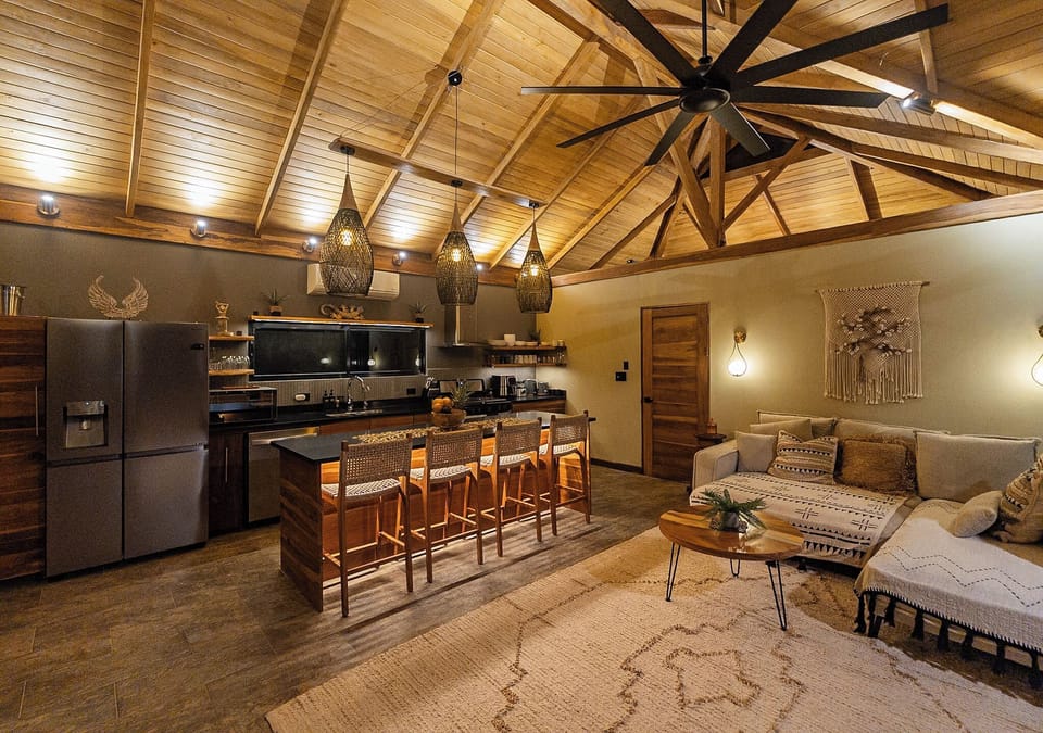 A comfy sleeper sofa in an airconditioned open concept living room to watch TV