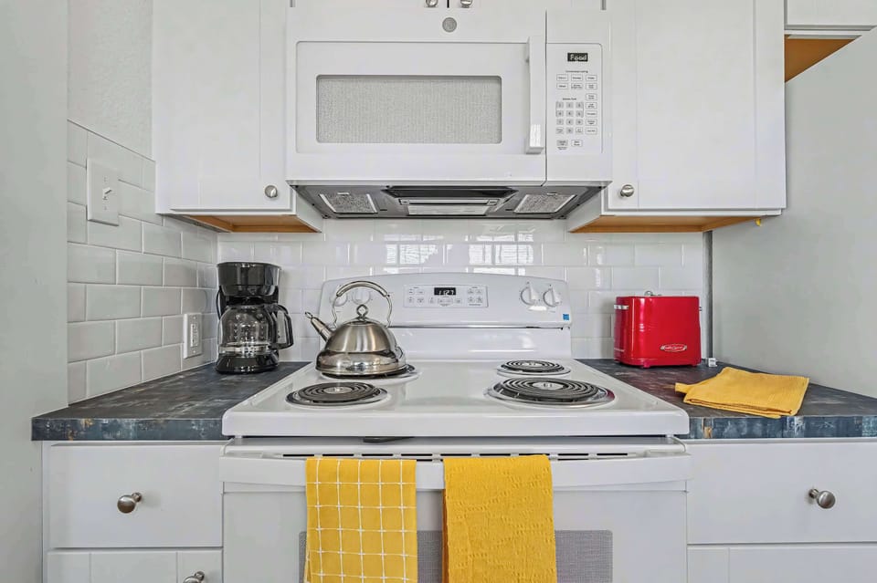 Kitchen with White Cabinets and Modern Appliances