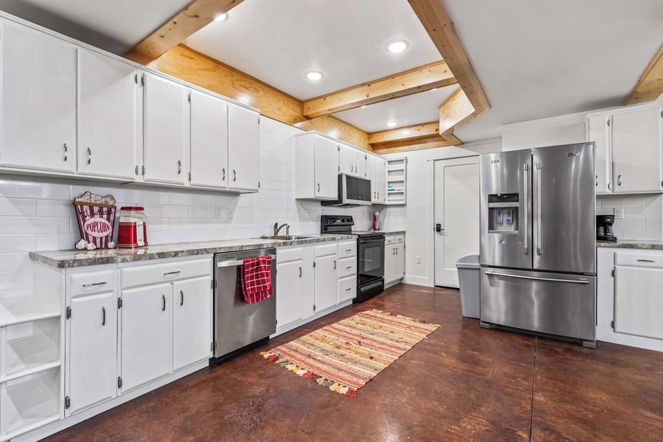 Second Kitchen Area in the Basement for Added Convenience During Group Stays
