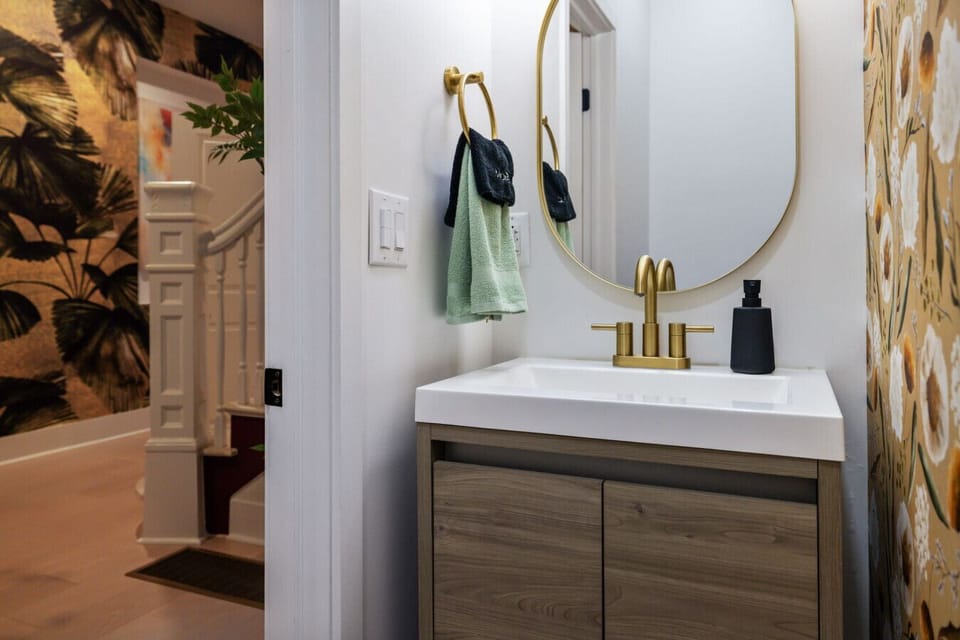 This half bathroom is as functional as it is chic! Perfect for guests, it adds a sprinkle of elegance and convenience to your visit.