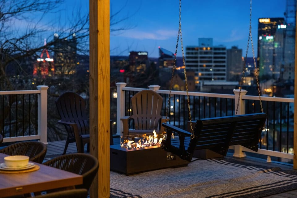 A swinging seat with a front-row view of the glowing city skyline.
