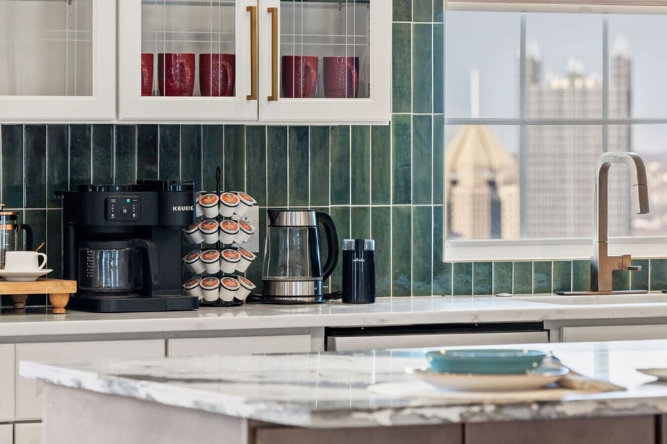 Start your day with coffee and a golden, panoramic skyline view.