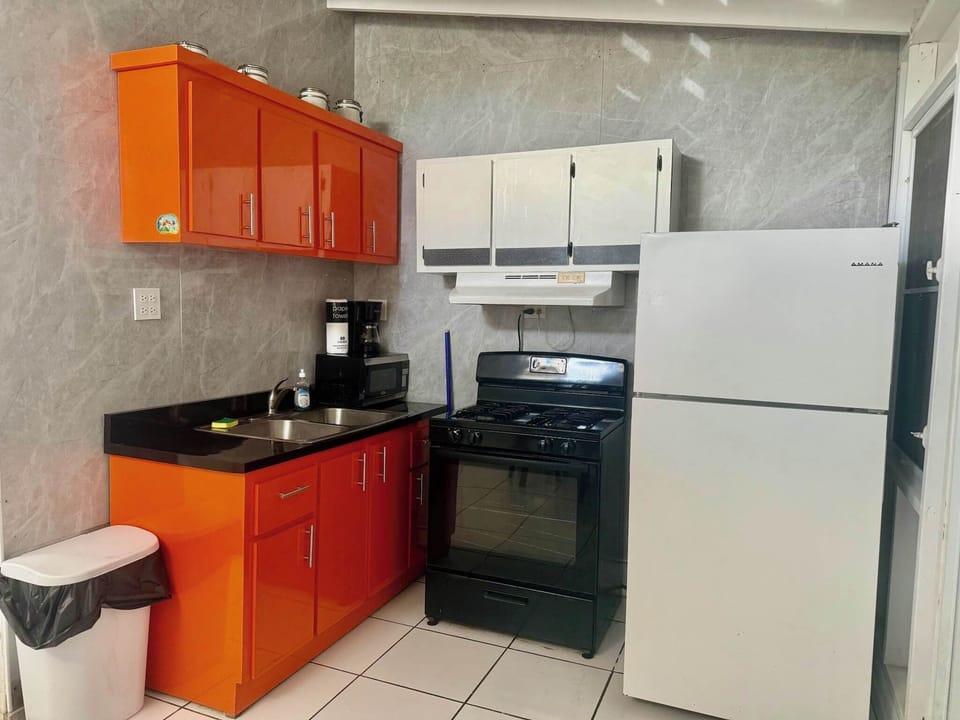Whip up delicious meals in our vibrant full kitchen, complete with a cozy dining area.