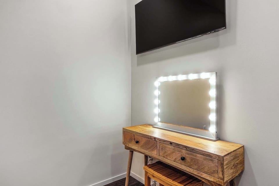 Bedroom with king bed, smart TV and desk