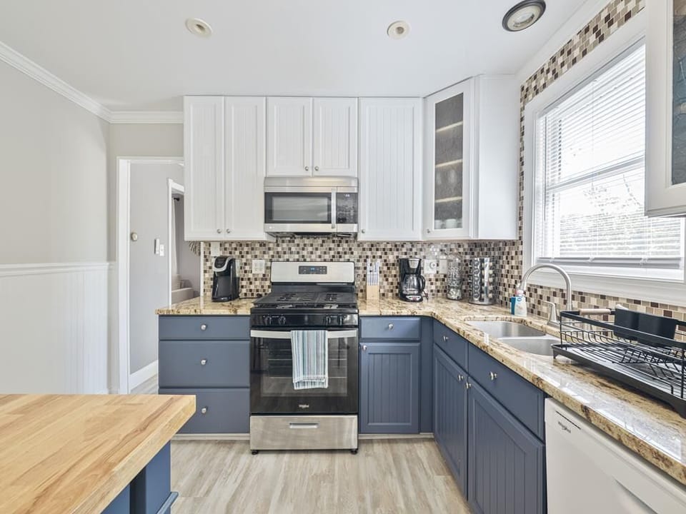 Experience culinary delights in an inviting kitchen, complete with sleek finishes and a cheerful atmosphere.