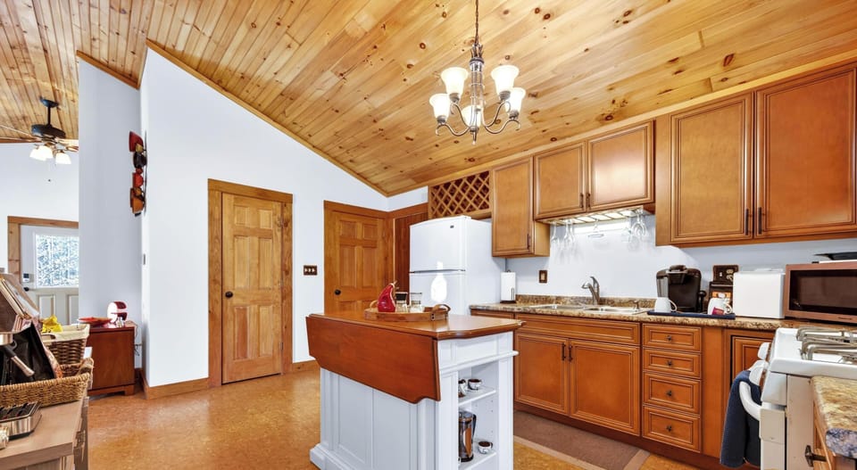 Spacious kitchen with warm wood accents and cozy charm