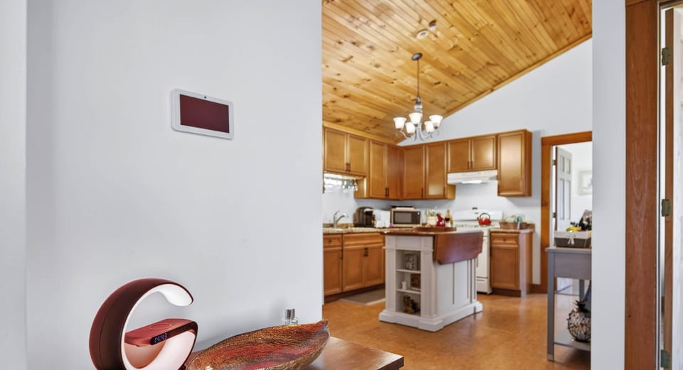 Cozy kitchen with vaulted ceilings and warm wood accents