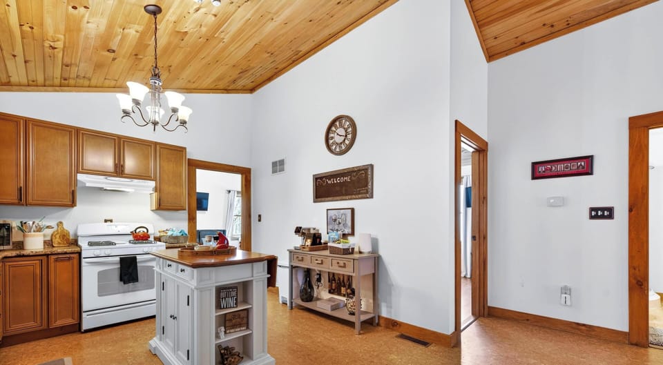 Spacious kitchen and dining area with vaulted ceilings