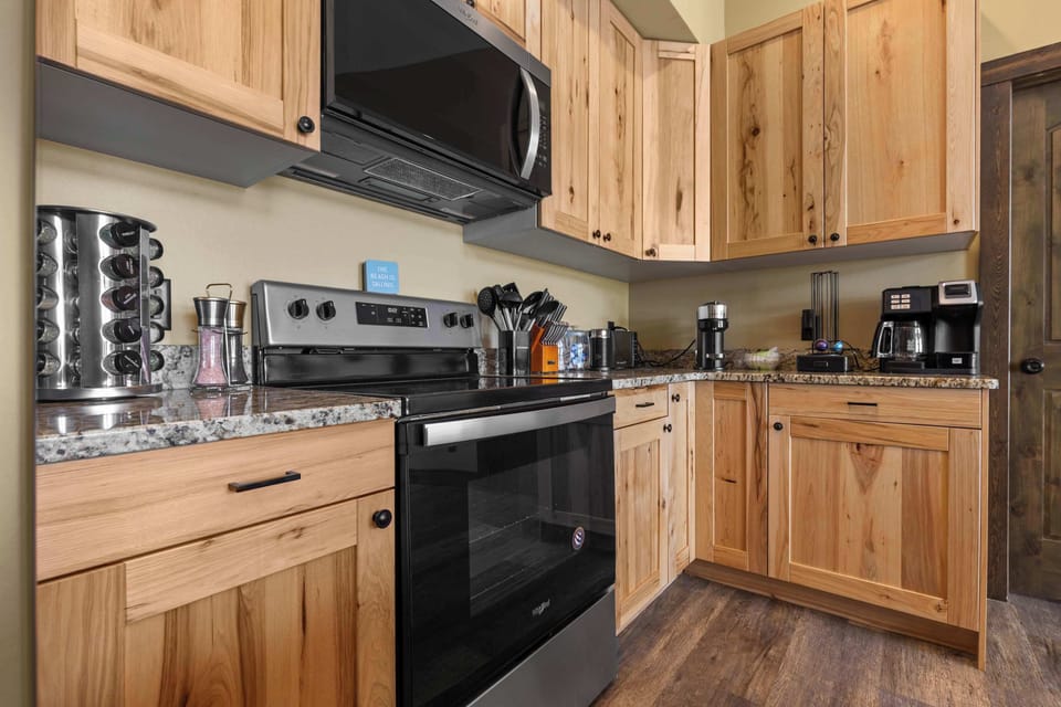 Our first kitchen is fully equipped for all your cooking needs, featuring ample counter space and modern appliances to ensure you can prepare delicious meals for your group with ease.