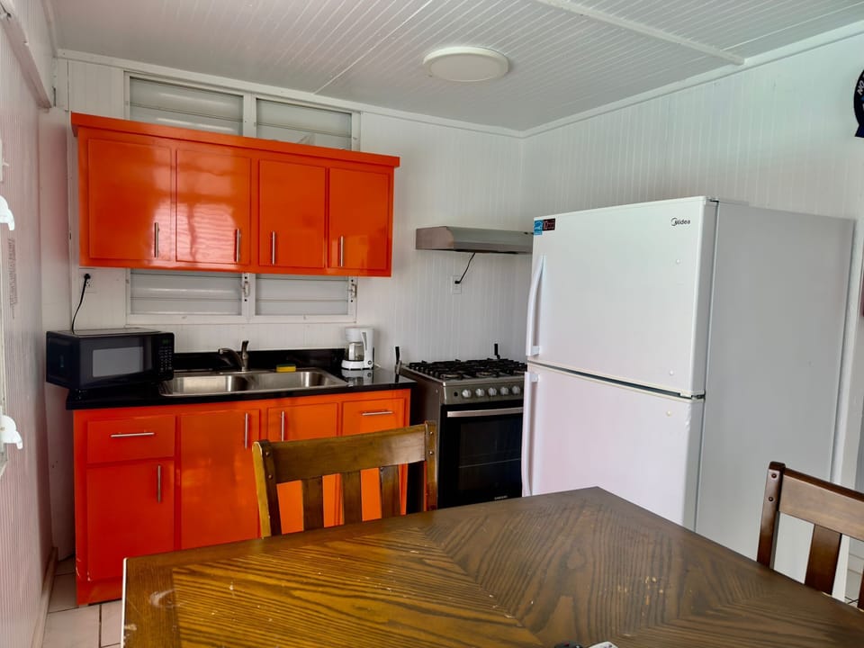 Cook up local flavors in this fully equipped kitchen with bold style.