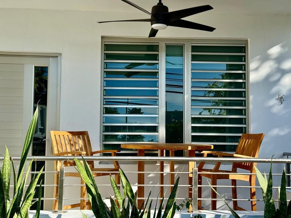 Unwind outdoors on the patio with a refreshing breeze from the ceiling fan.
