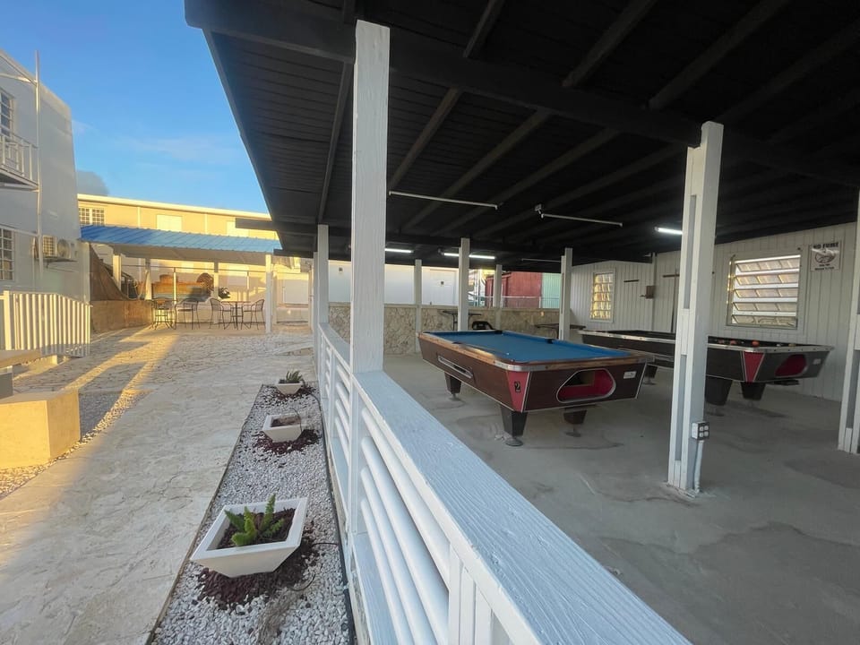 Enjoy a game of pool or relax in the inviting outdoor recreation space.