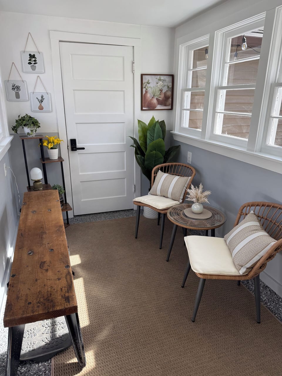 Beautifully decorated breezeway/sunroom to enjoy a book or cup of coffee.
