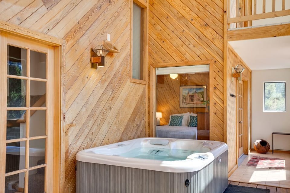 Hot tub is located in sunroom