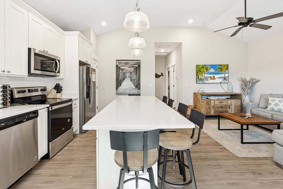 The kitchen and dining area feature an open layout with everything needed to prepare meals during your stay.