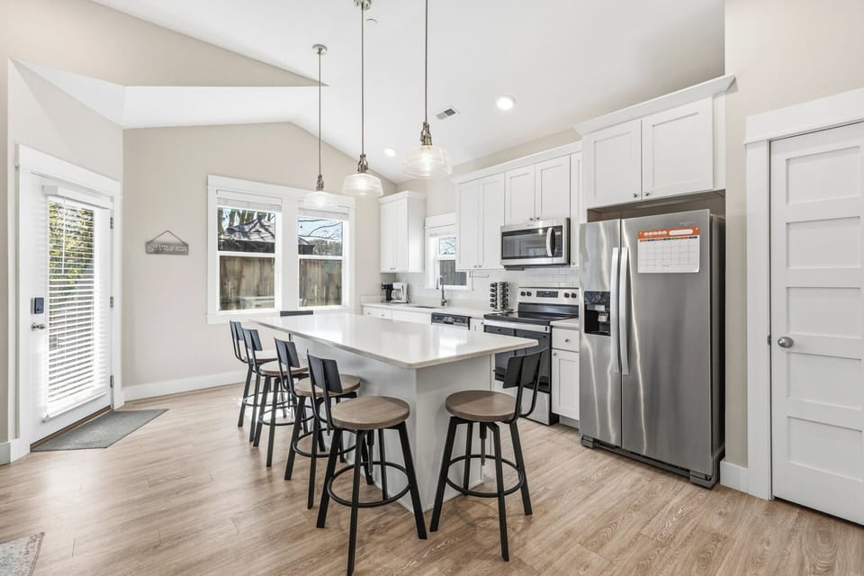 The kitchen and dining area feature an open layout with everything needed to prepare meals during your stay.