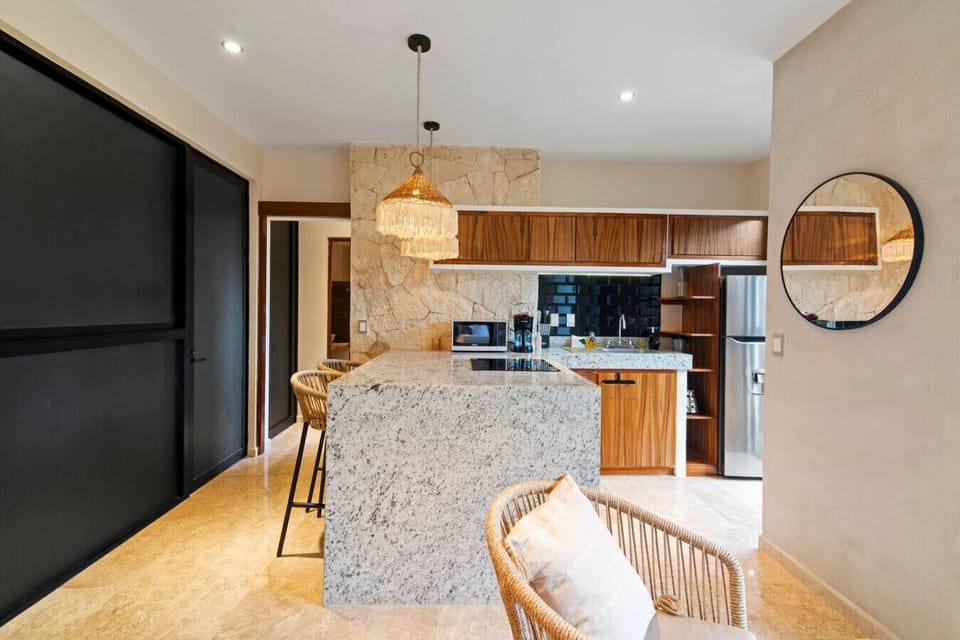 Elegant and thoughtfully designed space offering a modern kitchen, inviting lounge area.