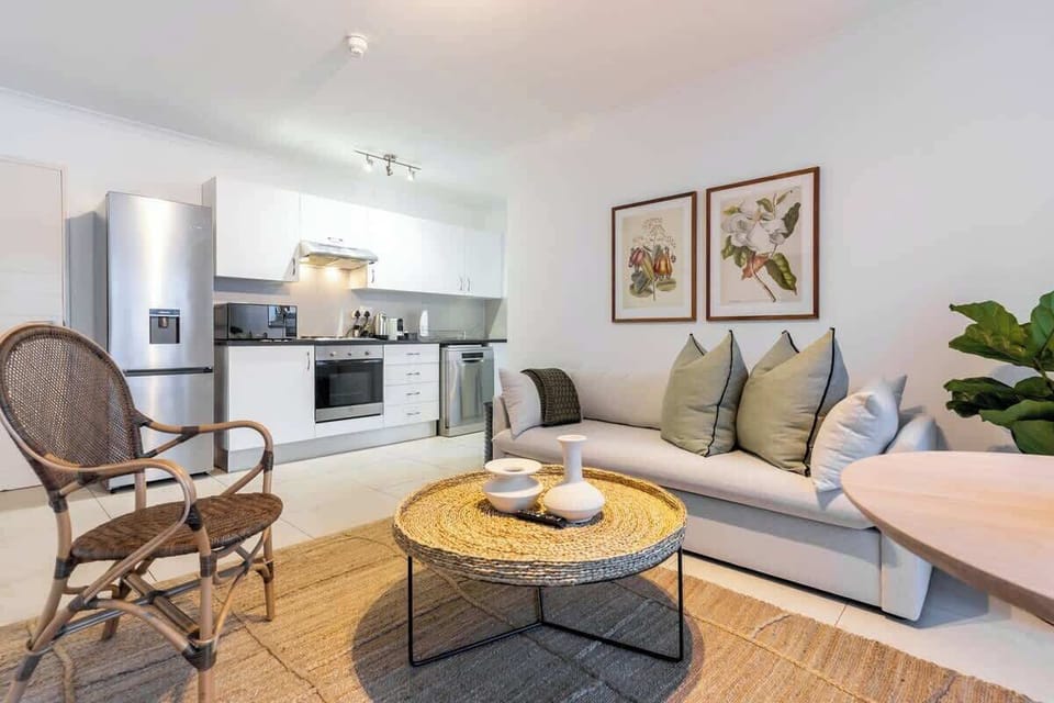 A full equipped yet compact kitchen is next to the living area