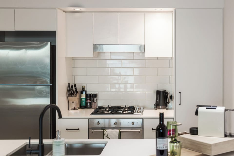 Deluxe Apartment, River View | Private kitchen | Espresso maker, coffee/tea maker, electric kettle, highchair