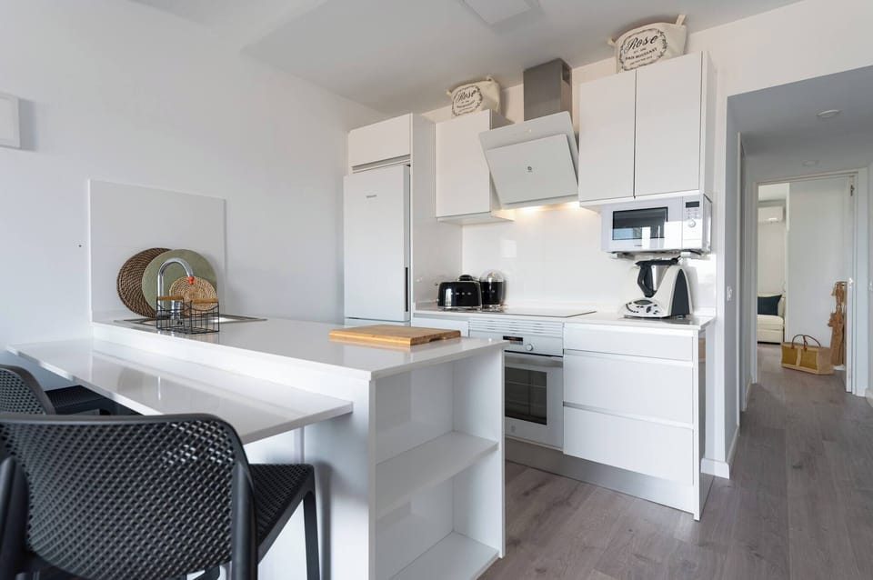 Open-plan kitchen with breakfast bar and high-quality appliances