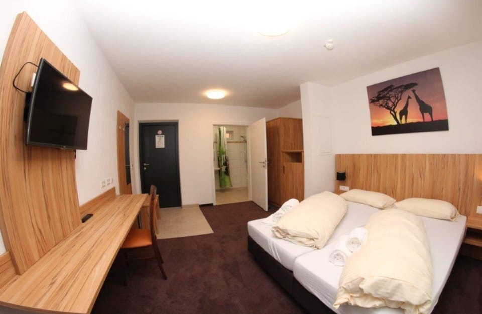 Premium bedding, desk, blackout drapes, soundproofing