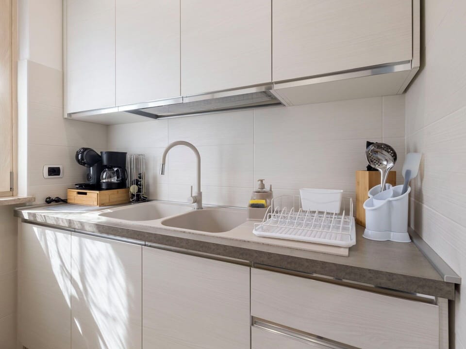 Kitchen, Countertop, Kitchen Appliance, Kitchen Sink, Cabinetry, Interior Design, Sink, Plumbing Fixture, Major Appliance, Home Appliance