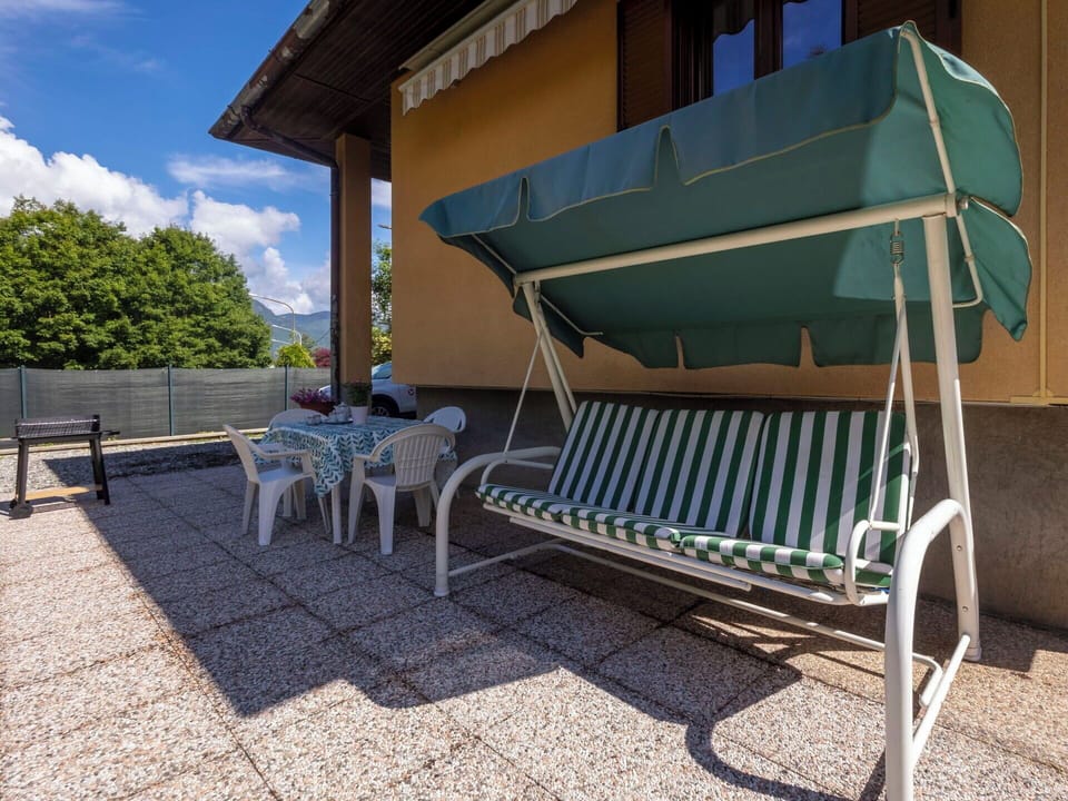 Furniture, Outdoor Furniture, Chair, Shade, Outdoor Table, Eco Hotel, Armrest, Sunlounger, Houseplant, Awning