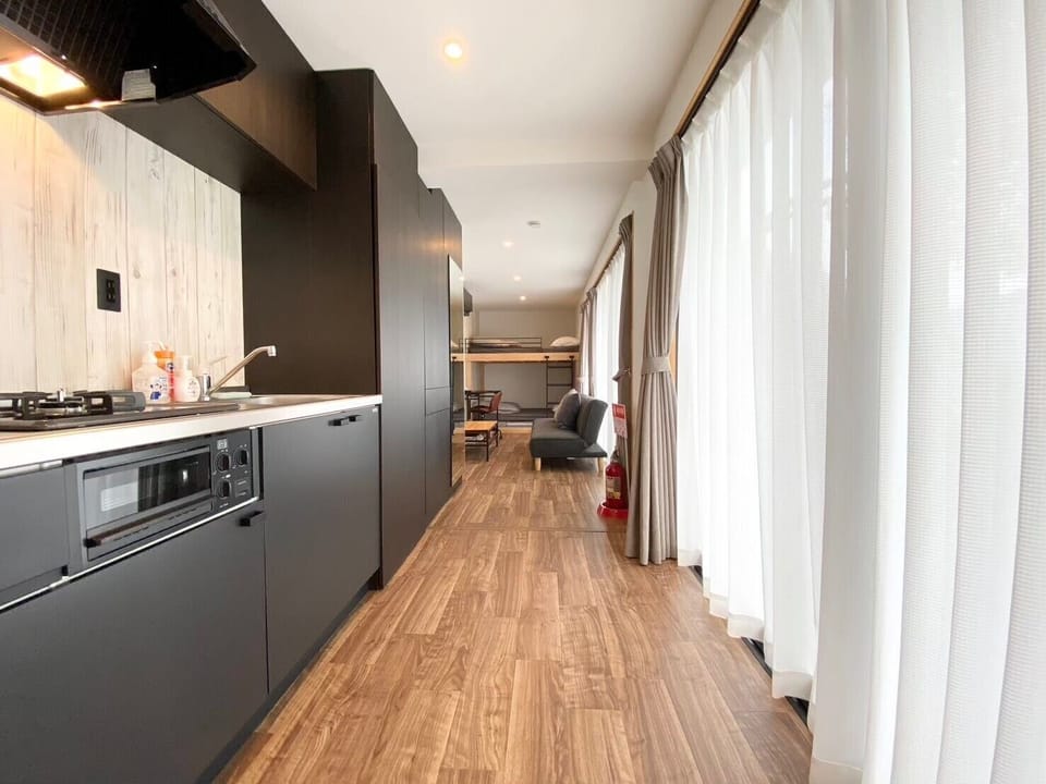 Full-size fridge, microwave, stovetop, cookware/dishes/utensils