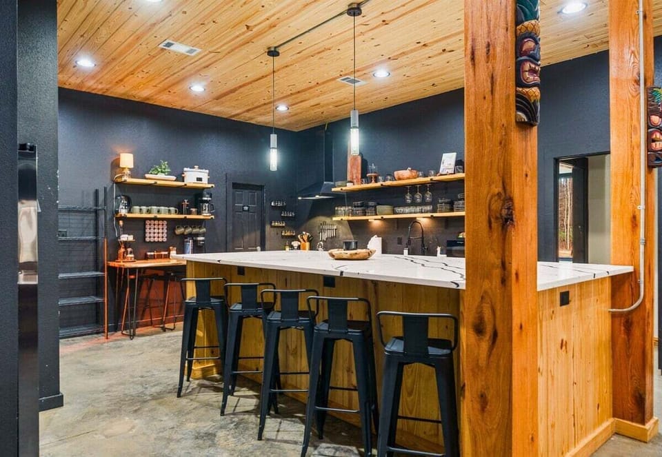 Pull up a stool and settle in at the bar, where conversations flow easily and everyone feels connected to the heart of the home.
