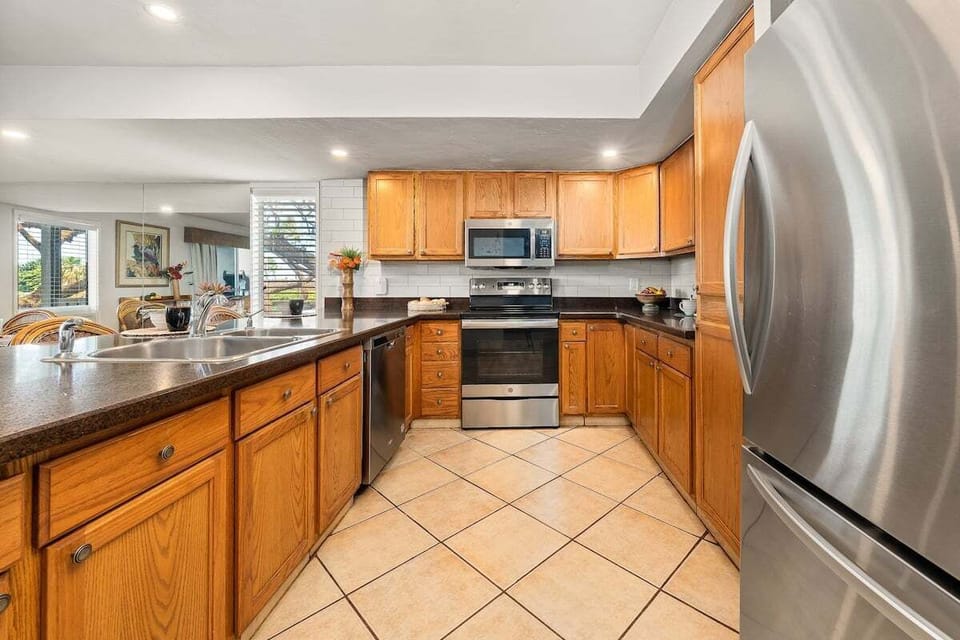 Fully equipped kitchen with ample cabinetry and full-sized appliances to make you feel right at home.