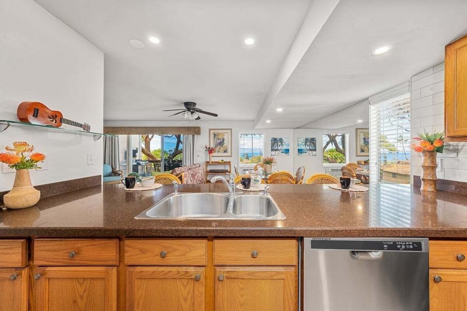 Expansive granite breakfast bar providing plenty of space for morning coffee or casual island snacks.