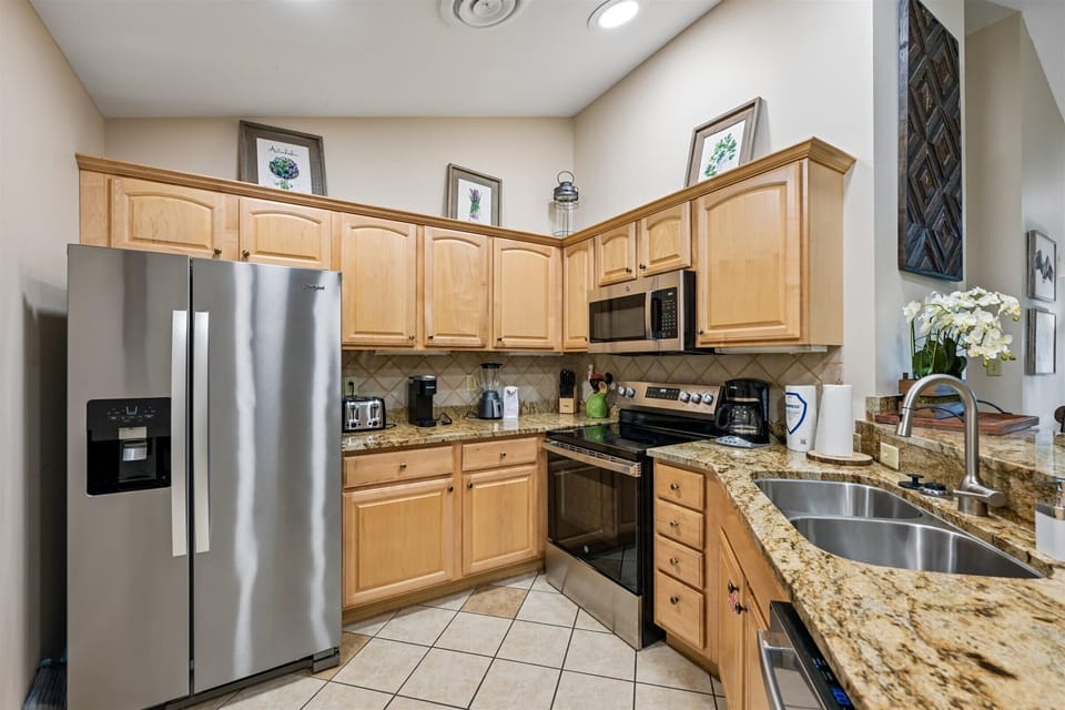 Your fully equipped kitchen features granite countertops, stainless steel appliances, and everything you need for home cooking during your stay.