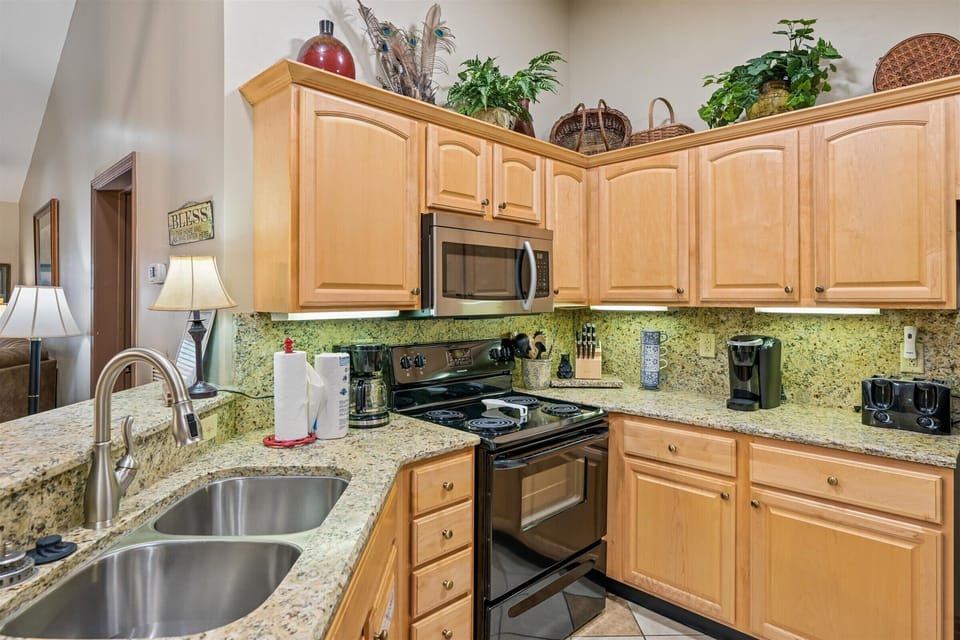 Your fully equipped kitchen features granite counters, stainless appliances, and charming touches that make cooking feel like home.