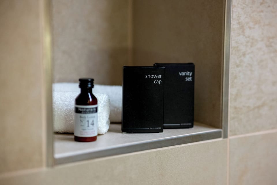 Deluxe Double or Twin Room, Bathtub | Bathroom | Hair dryer, towels, soap, shampoo