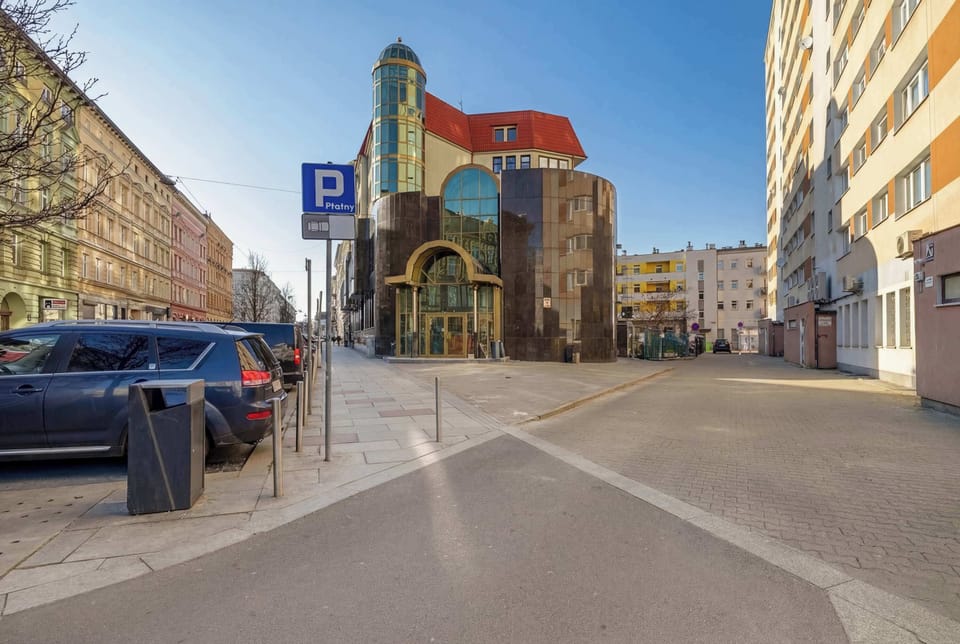 Another street view featuring a colorful building and urban surroundings. The location appears central and vibrant.