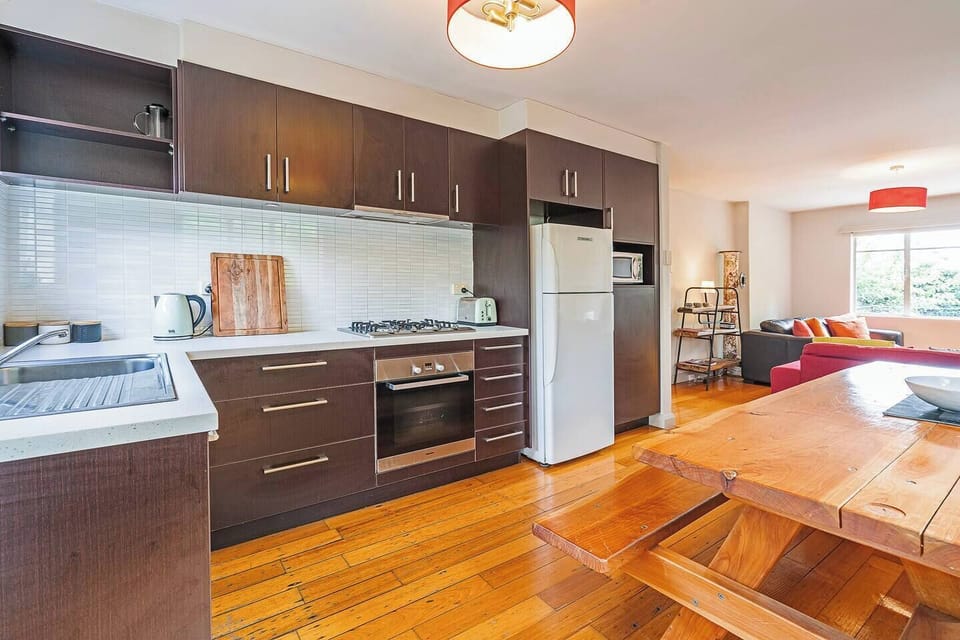 The fully equipped kitchen includes modern appliances and everything needed for easy home cooking.