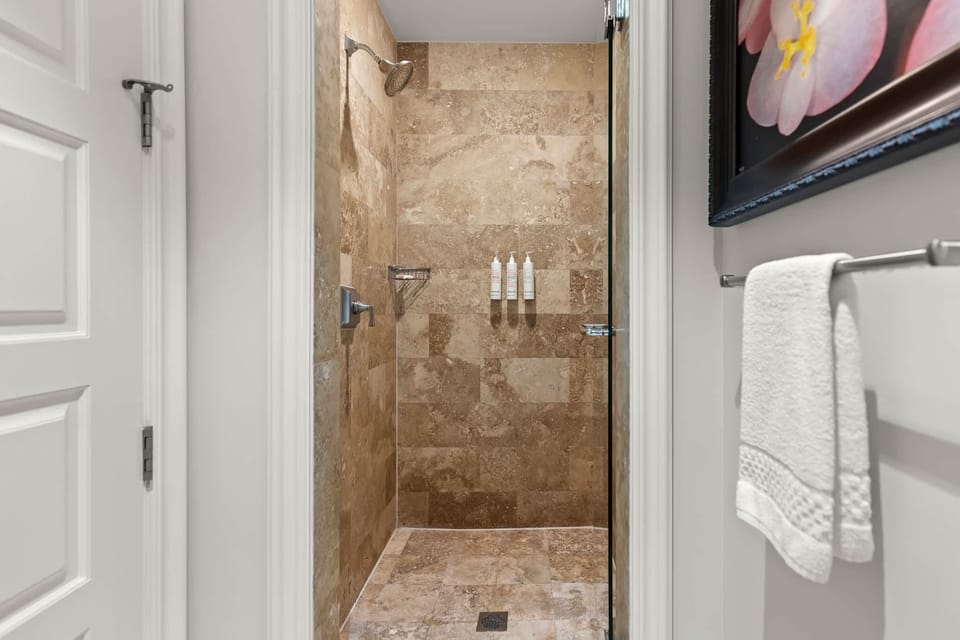 Tiled shower with glass door